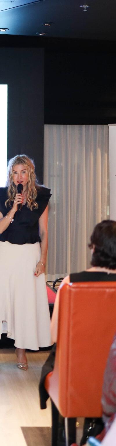 G-speaking-at-Dubai-event-scaled-1.jpeg — press and media photo featuring Guinevere Ellis